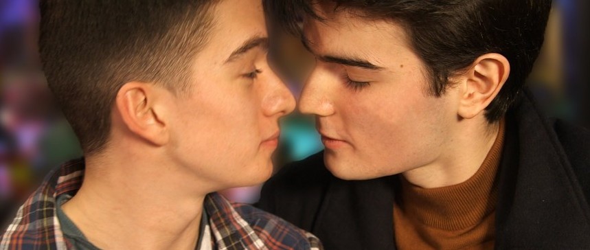 Gay young couple kiss